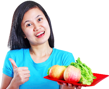 A woman with her thumbs up, holding a plate with apples and lettuce on it