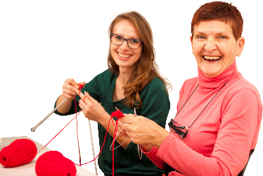 2 women knitting together