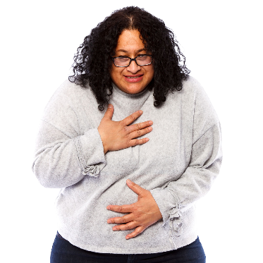 A woman with 1 hand on her chest and 1 hand on her stomach