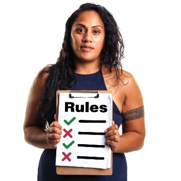 A woman holding a clipboard with a list of rules on it