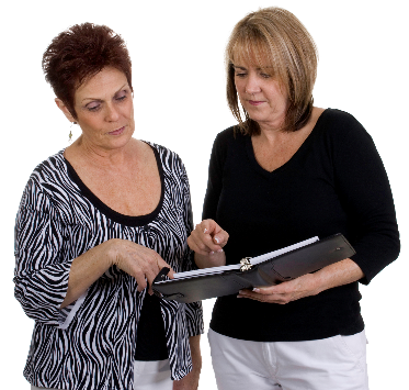 Two woman reading a document together