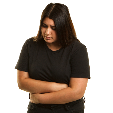 Image of a woman with her hands folded looking sad